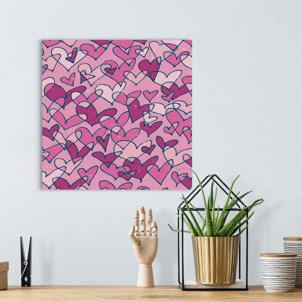 A bohemian room featuring A pattern of pen and ink illustrated pink hearts on a pink background.