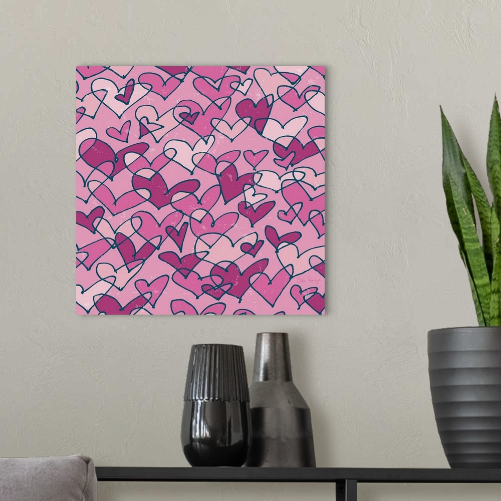 A modern room featuring A pattern of pen and ink illustrated pink hearts on a pink background.