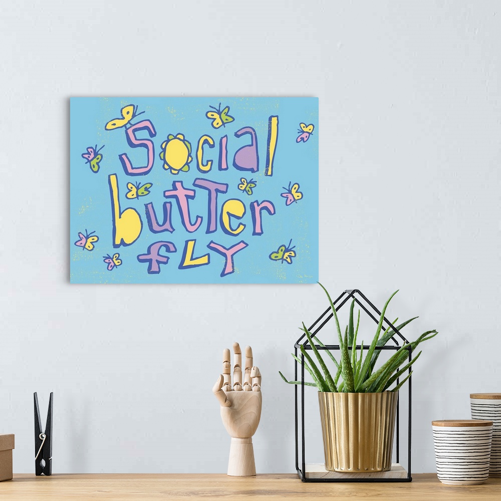 A bohemian room featuring Pen and Ink illustration artwork of small butterflies hovering all over the phrase "Social Butter...