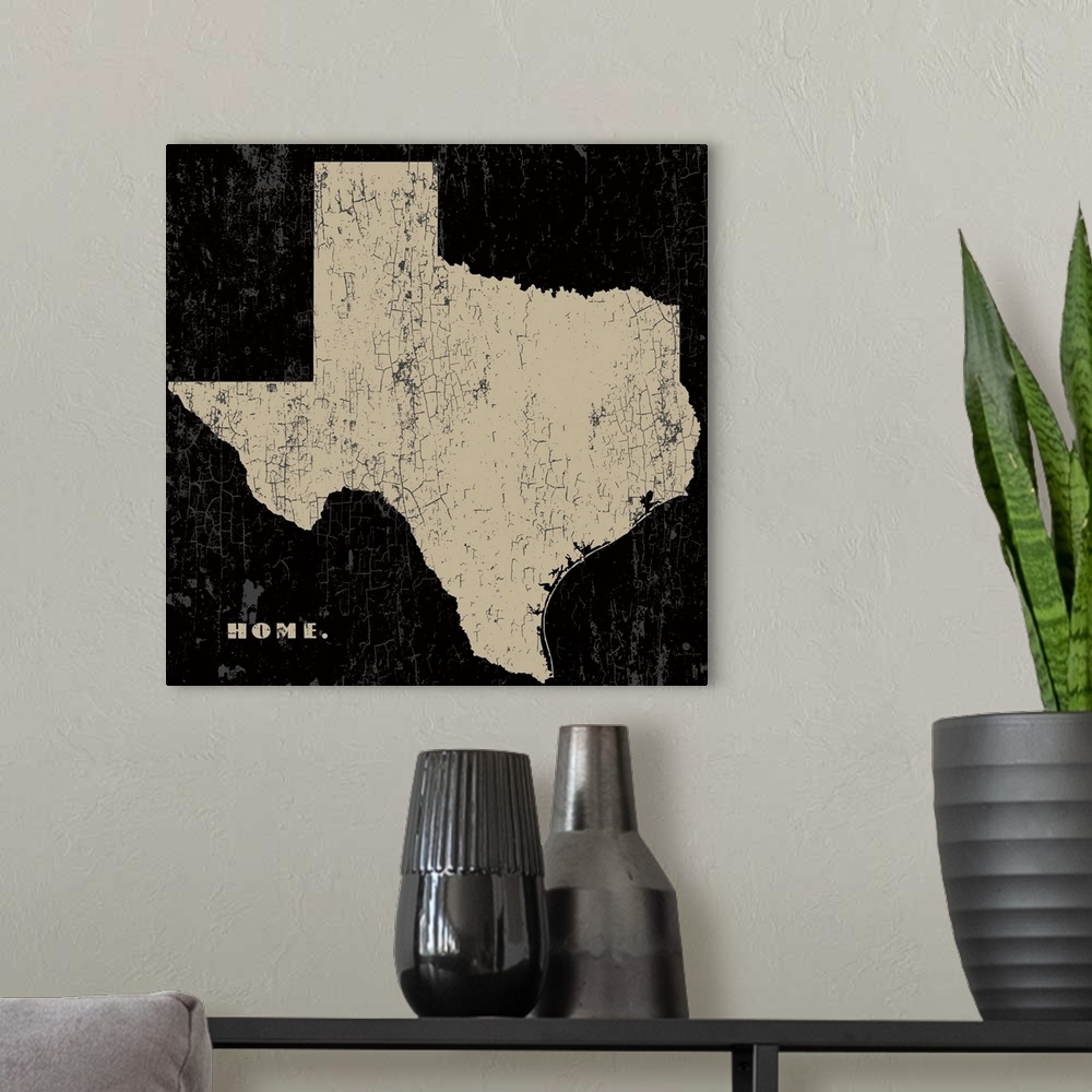 A modern room featuring Distressed wall art graphic art of the state of Texas with the word home in the lower left corner...