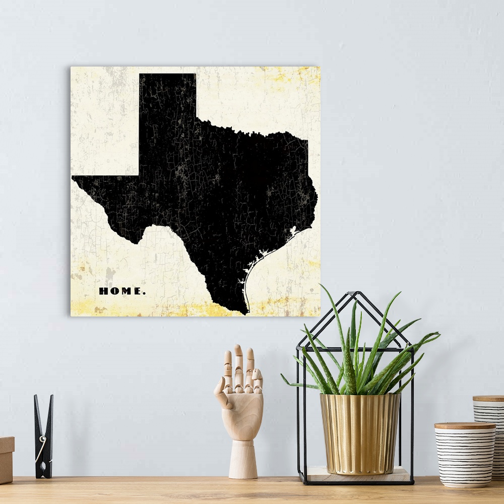 A bohemian room featuring Distressed wall art graphic art of the state of Texas with the word home in the lower left corner...