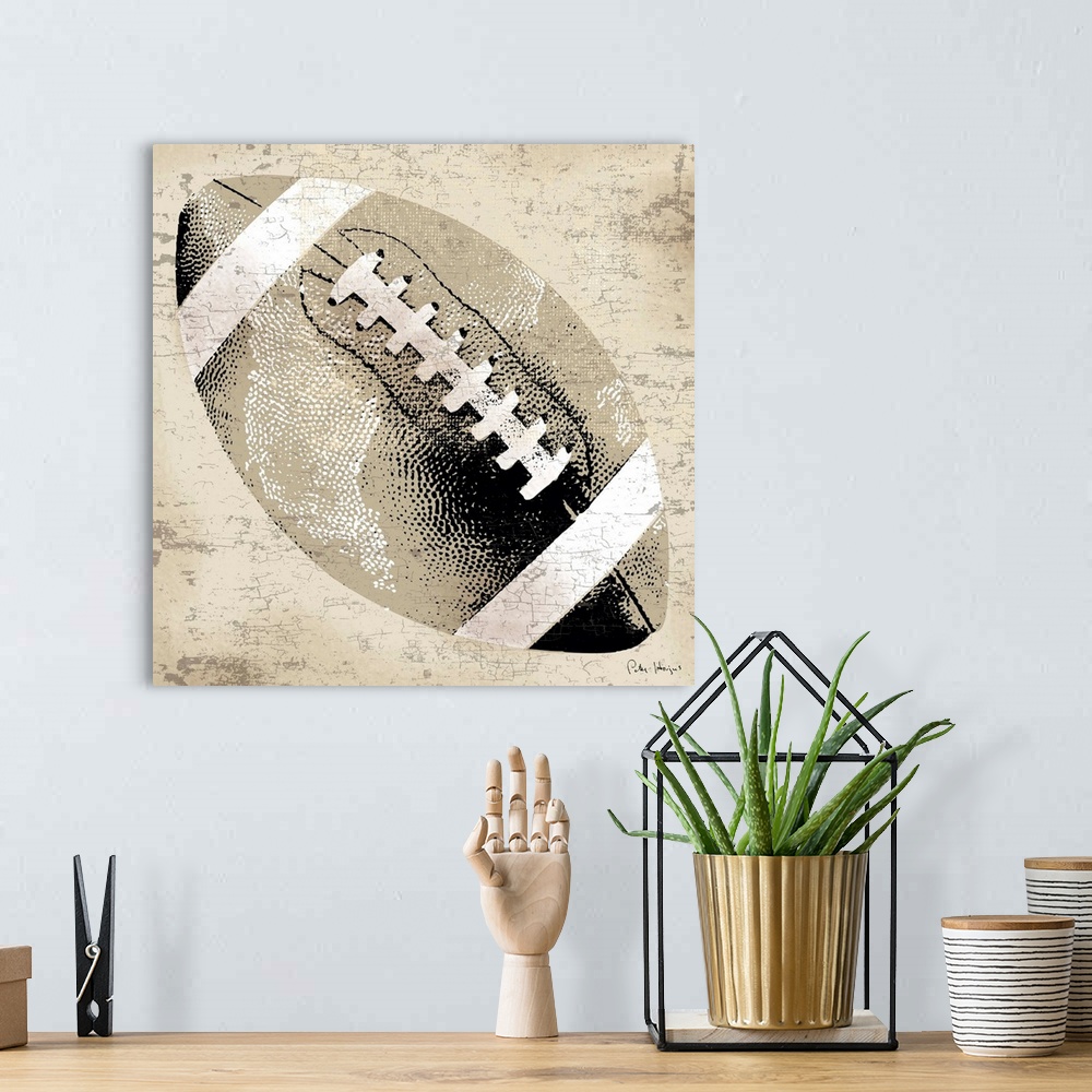 A bohemian room featuring Vintage style wall art of an old distressed football on tan and sepia background.