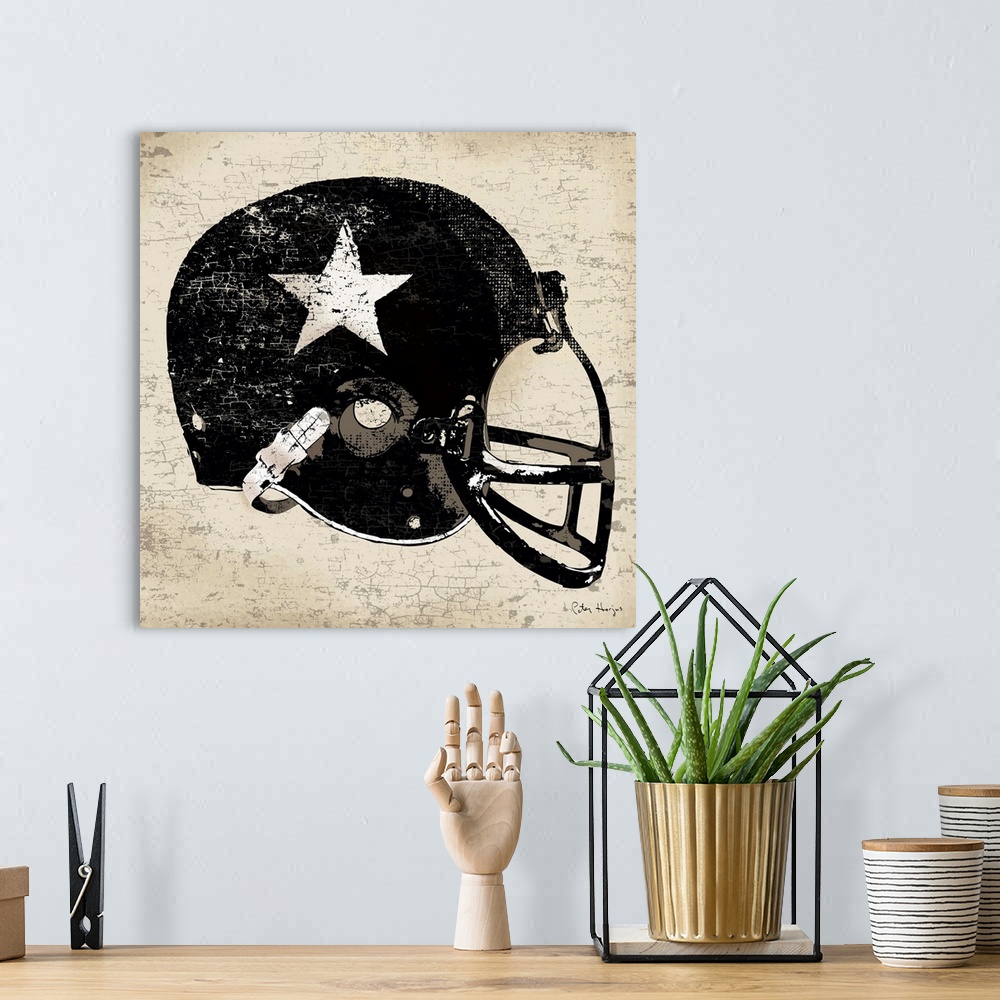 A bohemian room featuring Vintage style wall art of an old distressed football helmet on tan and sepia background.