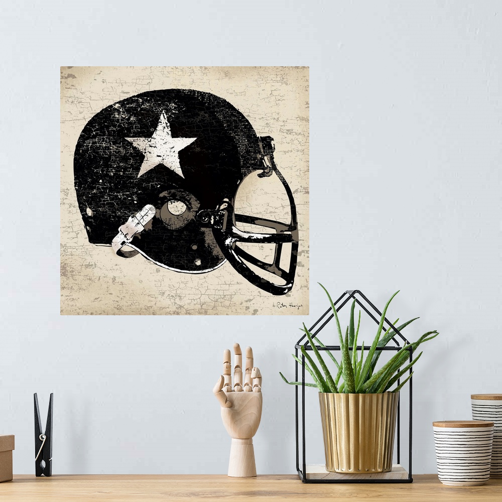 A bohemian room featuring Vintage style wall art of an old distressed football helmet on tan and sepia background.