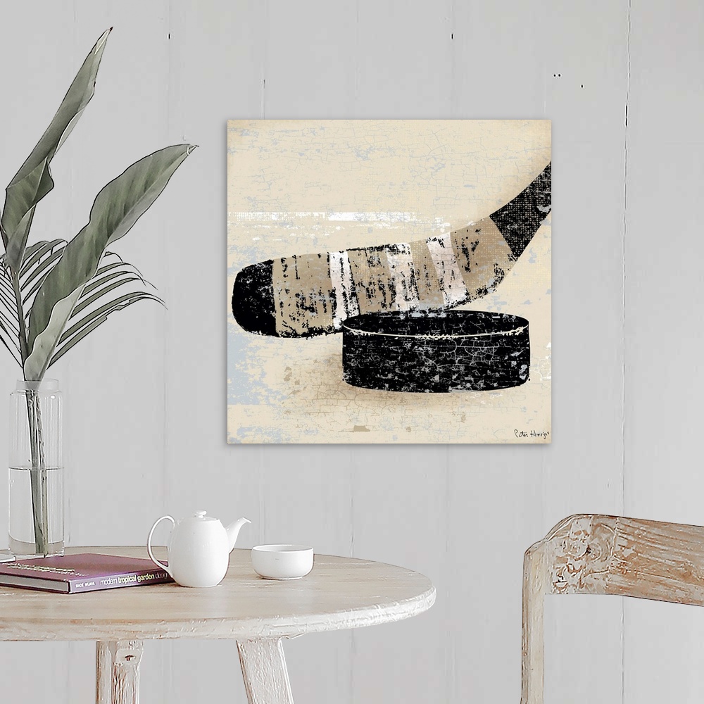 A farmhouse room featuring Vintage style wall art of an old distressed hockey stick and puck on tan and sepia background.