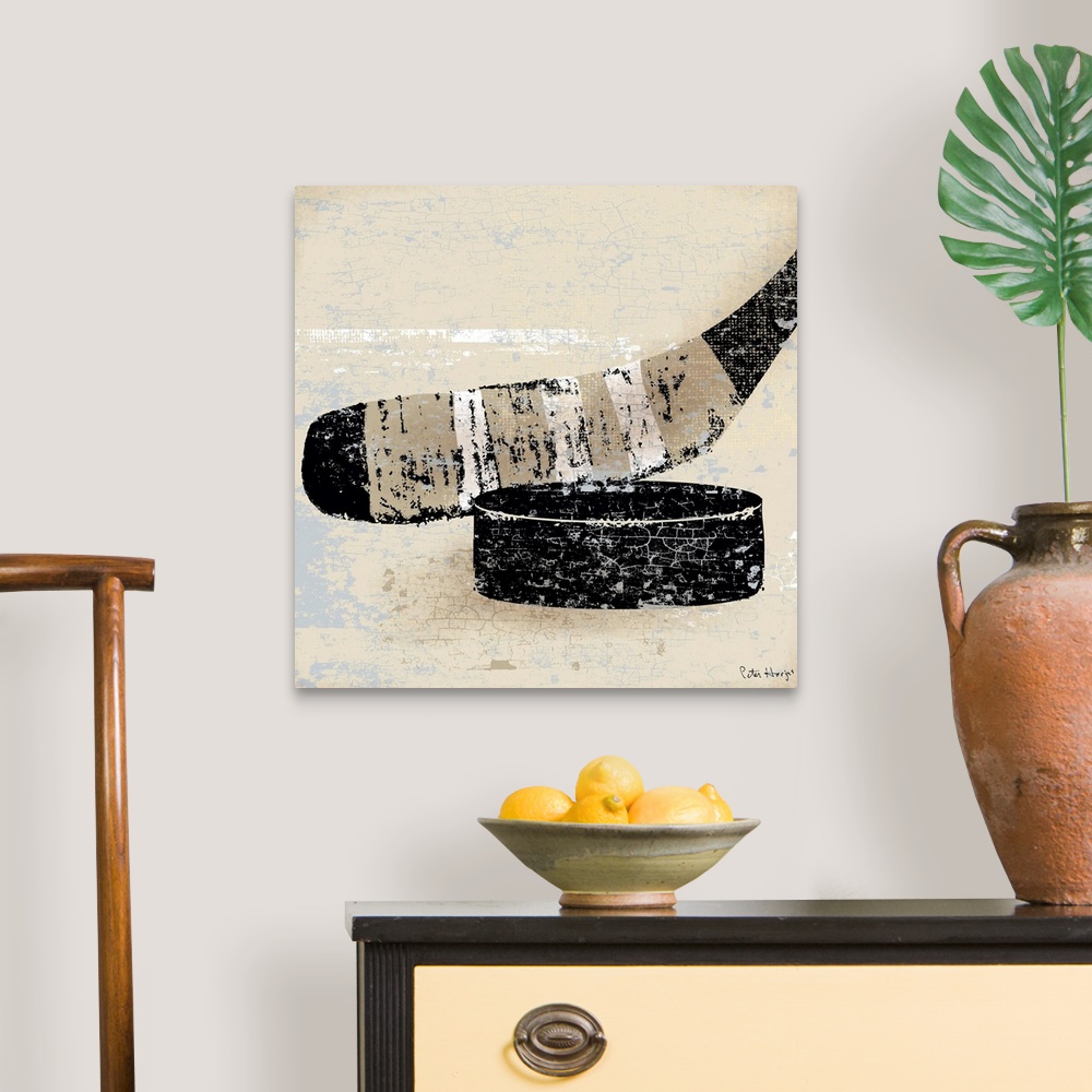 A traditional room featuring Vintage style wall art of an old distressed hockey stick and puck on tan and sepia background.