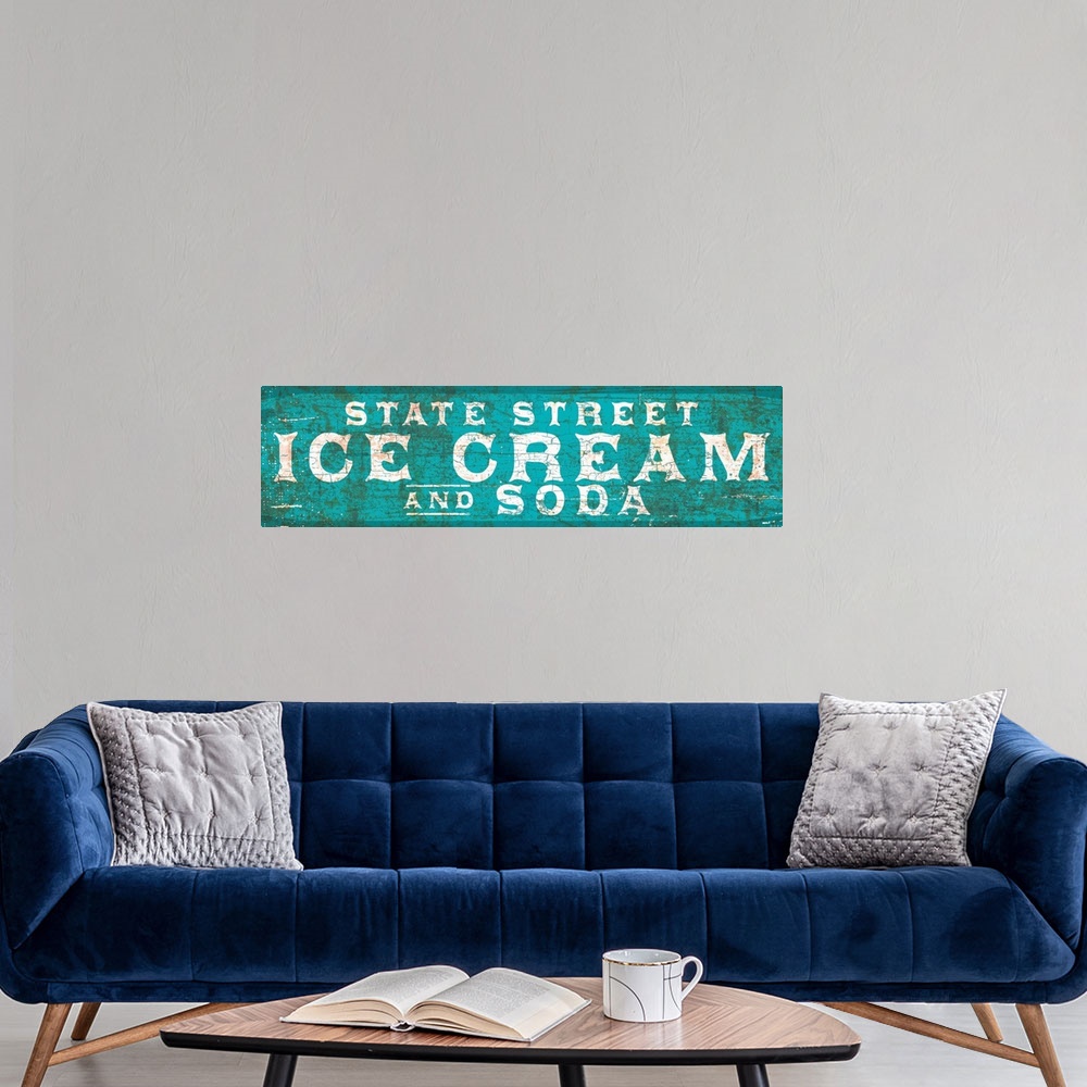 A modern room featuring Vintage rusty 1890's distressed trade sign wall art with typography reading State Street Ice Cream.