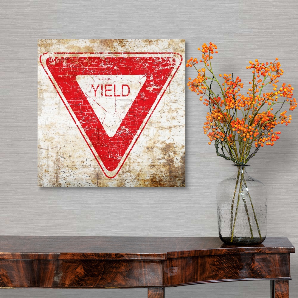 A traditional room featuring A worn, distressed, cracked and rusty Yield street sign.