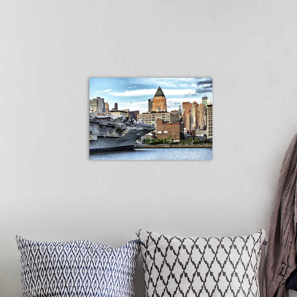 A bohemian room featuring Fine art photo of a large military ship in New York harbor.