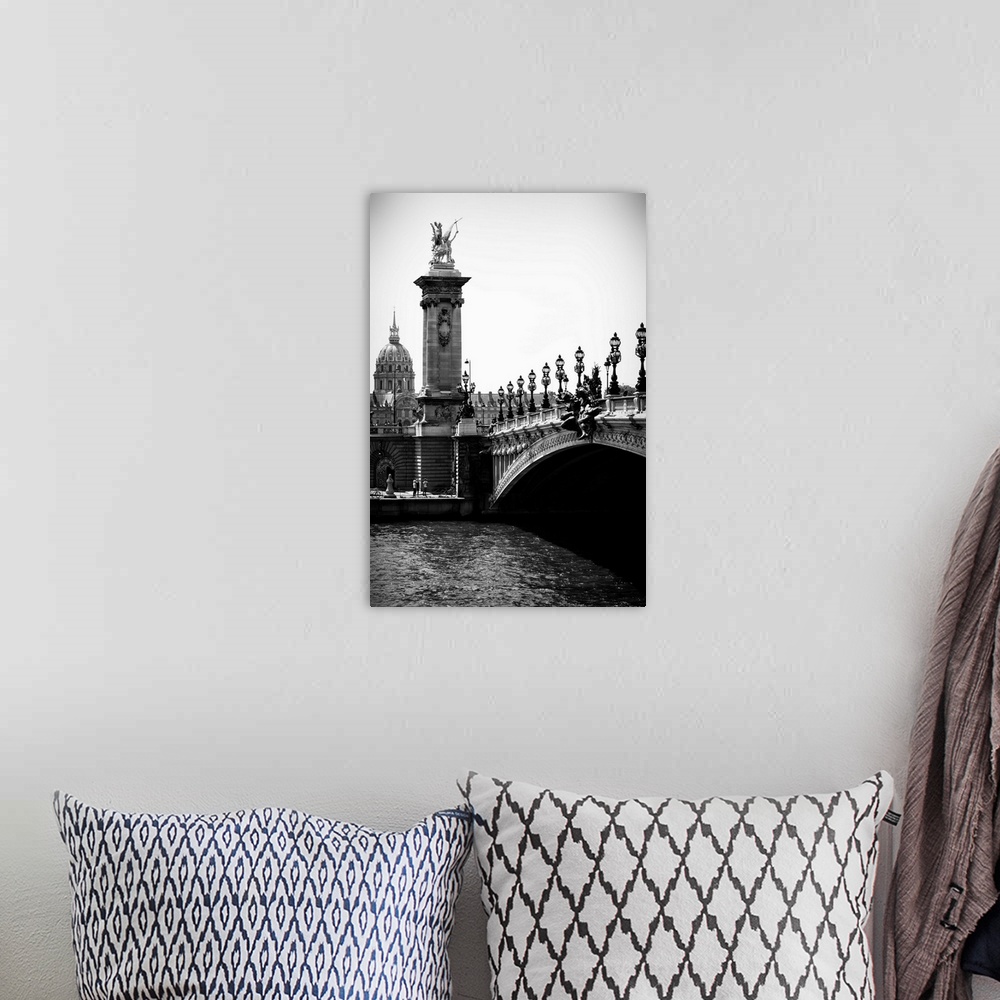 A bohemian room featuring A black and white photograph of the Alexandre III bridge in Paris.