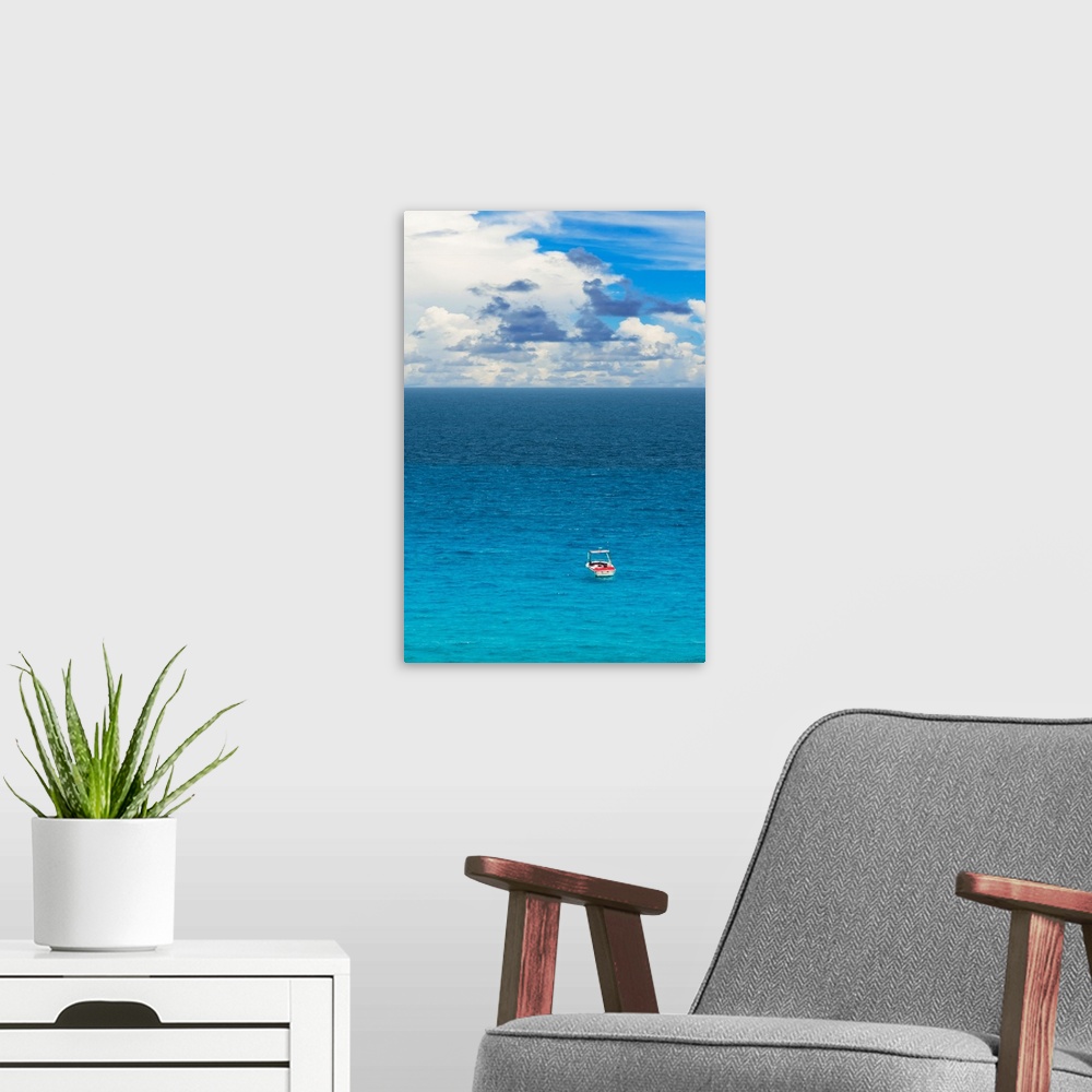 A modern room featuring Photograph of a single boat on the clear blue sea. From the Viva Mexico Collection.