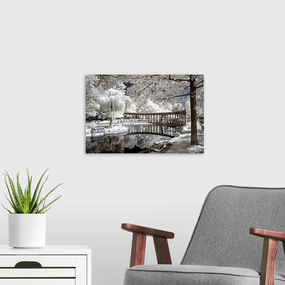 A modern room featuring A view of ancient architecture in Paris, made in infrared mode in summer. The vegetation is white...