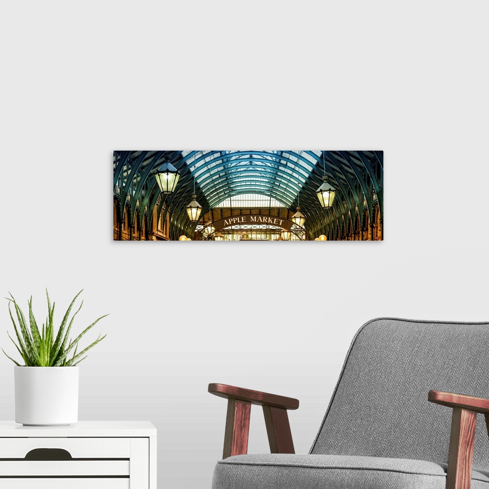 A modern room featuring Panoramic image of the arches and hanging lamps in Covent Garden Market.