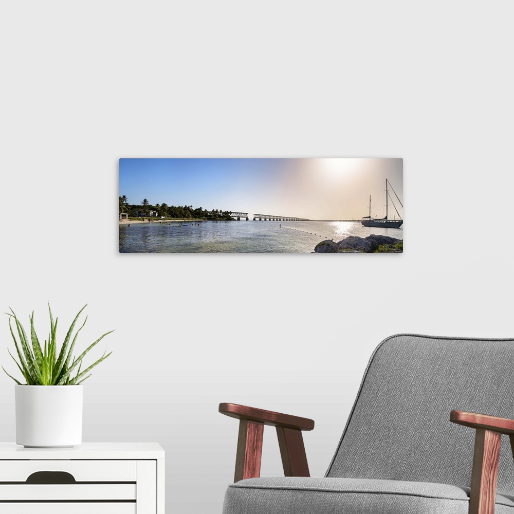 A modern room featuring Fine art photo of the sea in Bahia Honda State Park, under bright sunlight, Florida.