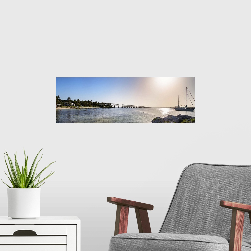 A modern room featuring Fine art photo of the sea in Bahia Honda State Park, under bright sunlight, Florida.