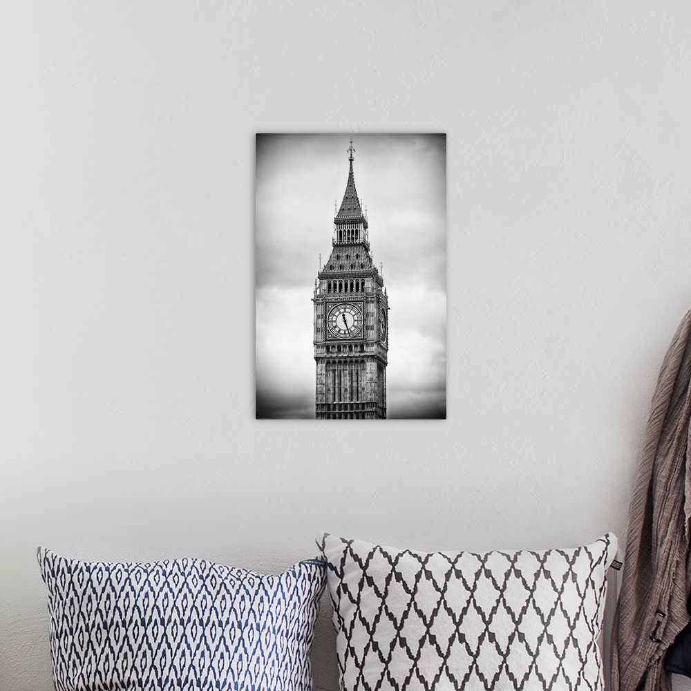A bohemian room featuring Black and white photograph of the clock tower on an overcast day.