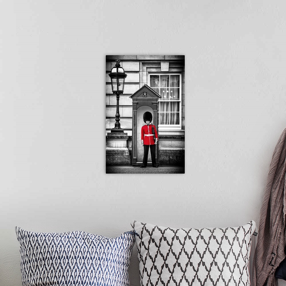A bohemian room featuring Photo with selective color of a guard in traditional uniform at Buckingham Palace in London, Engl...