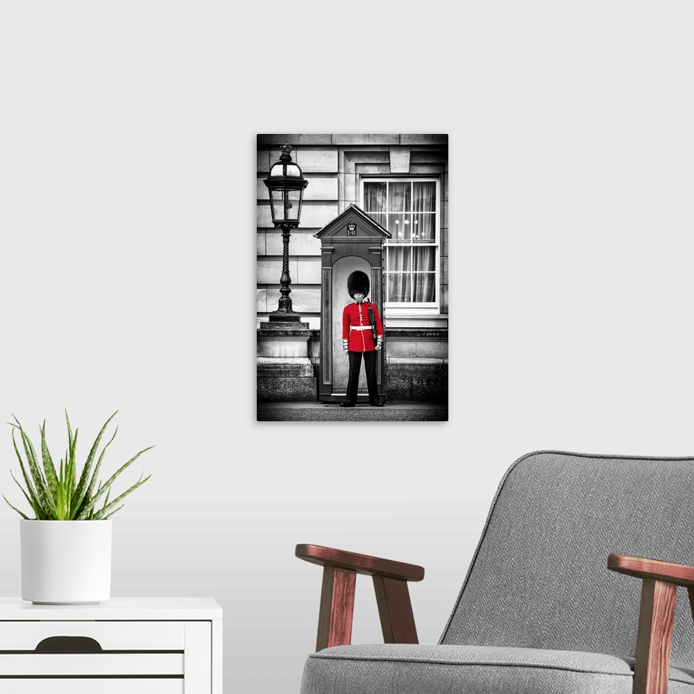 A modern room featuring Photo with selective color of a guard in traditional uniform at Buckingham Palace in London, Engl...