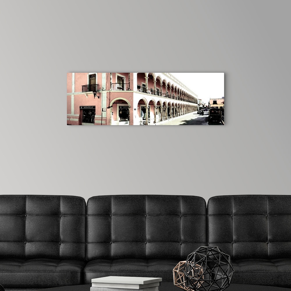 A modern room featuring Washed out panoramic photograph of a streetscape in Campeche, Mexico, with pink architecture. Fro...