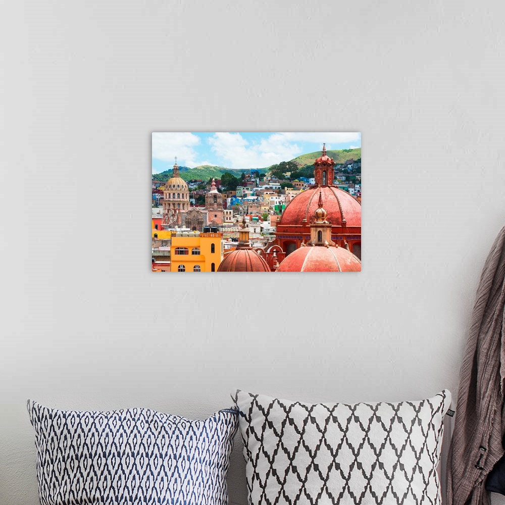 A bohemian room featuring Cityscape photograph of colorful buildings and several church domes in Guanajuato, Mexico. From t...