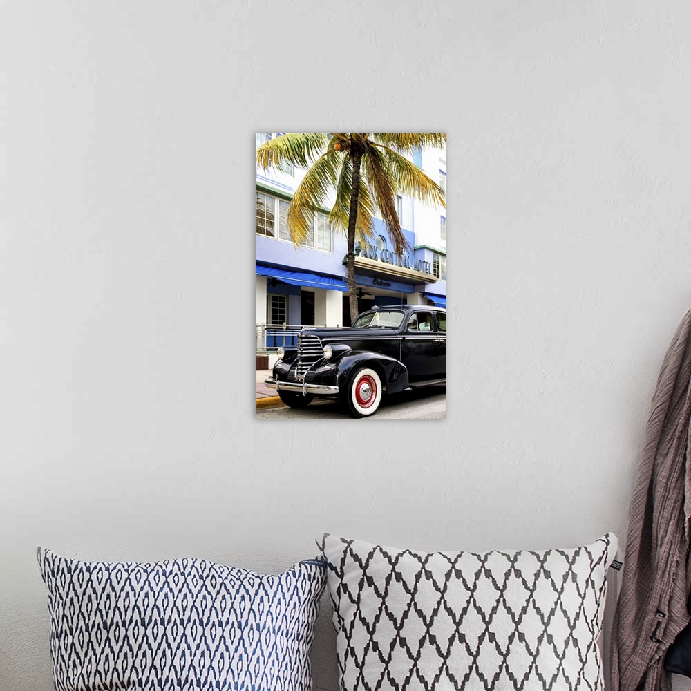 A bohemian room featuring Photograph of a classic car in Miami, Florida, under a palm tree.