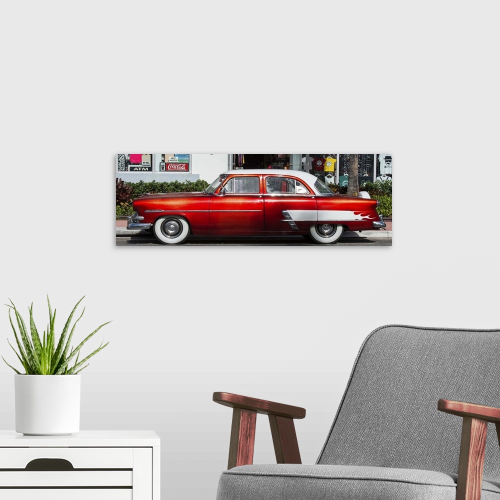 A modern room featuring A bright red vintage car in Miami, Florida.