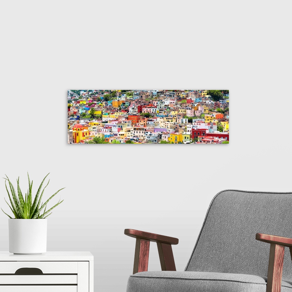 A modern room featuring Colorful panoramic aerial photograph of a cityscape in Guanajuato, Mexico. From the Viva Mexico P...