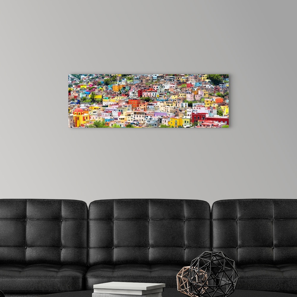A modern room featuring Colorful panoramic aerial photograph of a cityscape in Guanajuato, Mexico. From the Viva Mexico P...