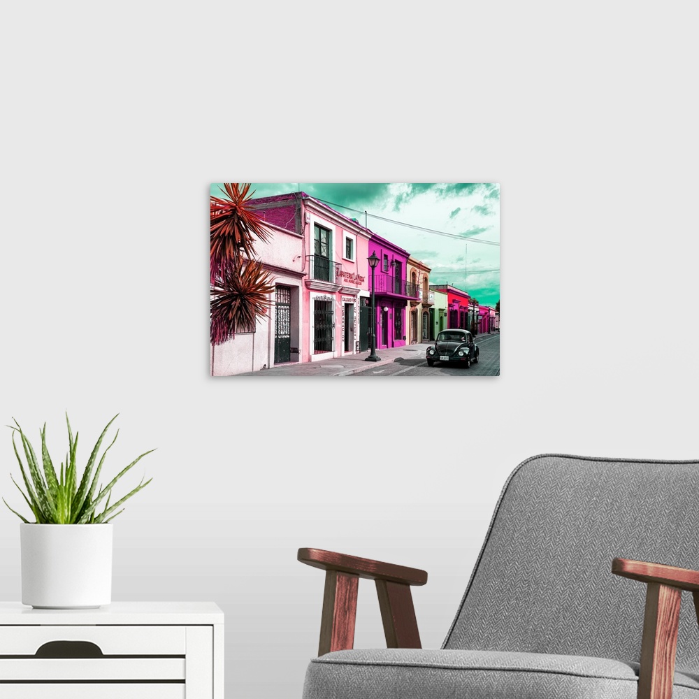 A modern room featuring Colorful photograph of pink facades and a black Volkswagen Beetle driving down the street. From t...