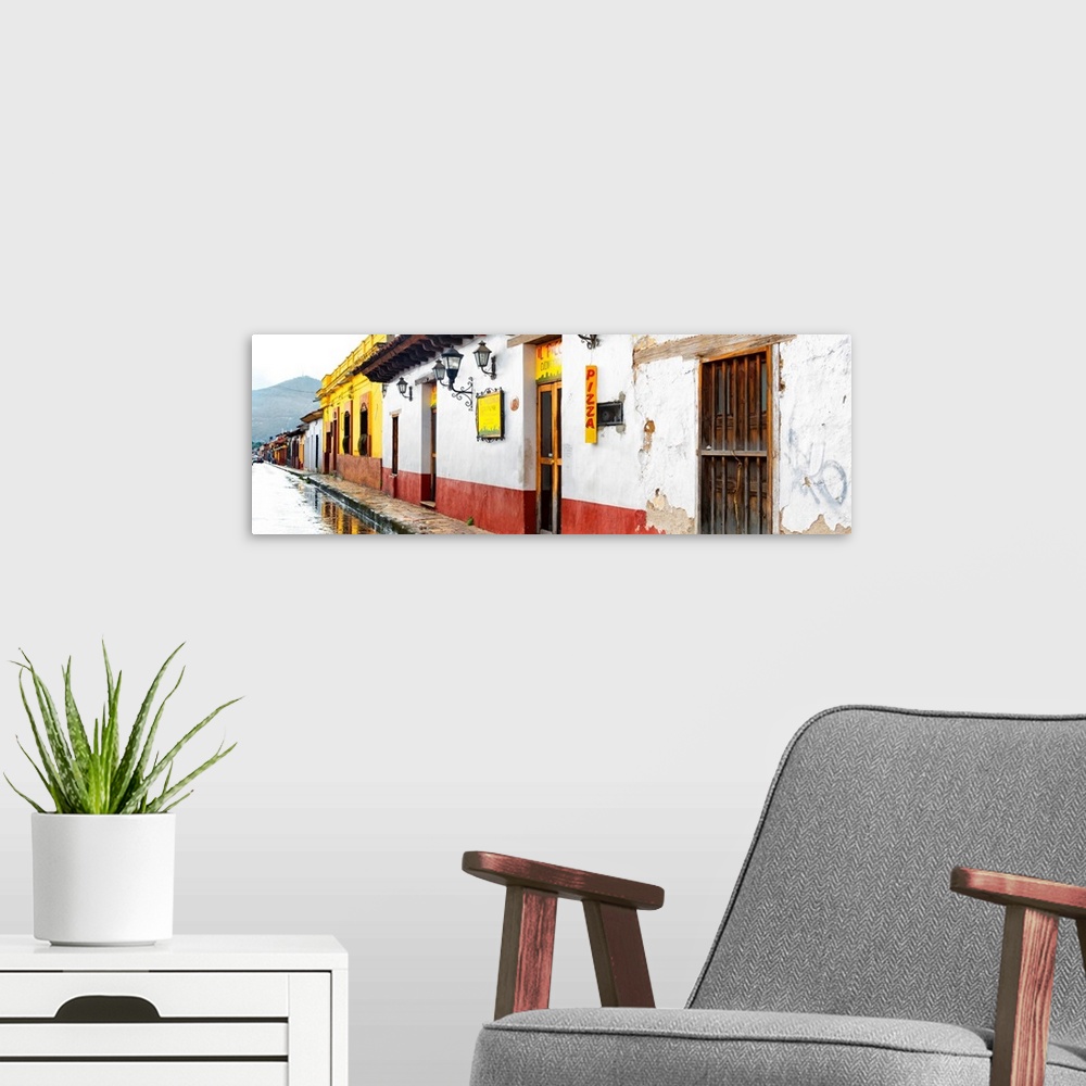 A modern room featuring Panoramic photograph of an overcast and rainy street scene by a pizza shop in Mexico. From the Vi...