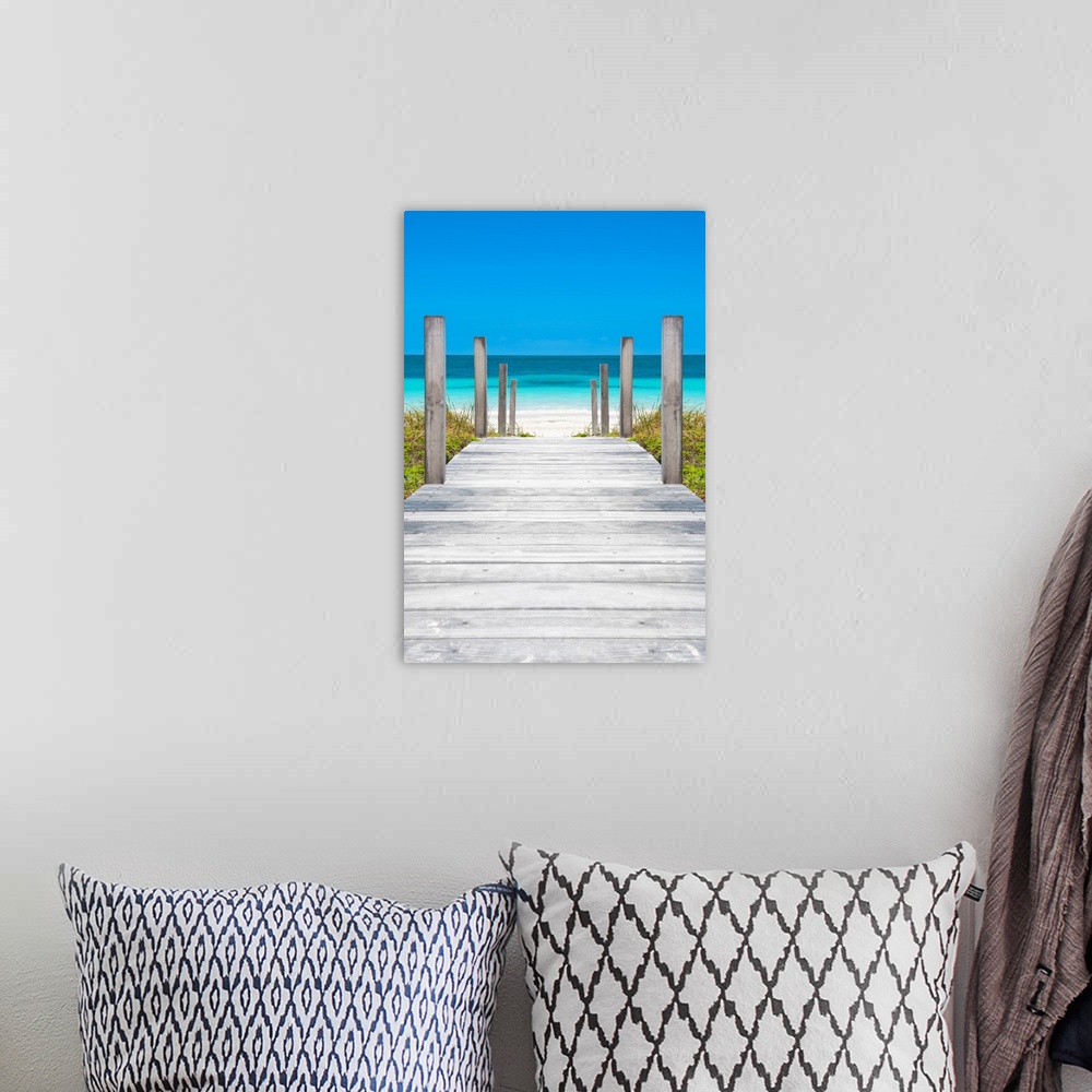 A bohemian room featuring Photograph of a wooden boardwalk leading straight to the crystal blue ocean in Cuba.