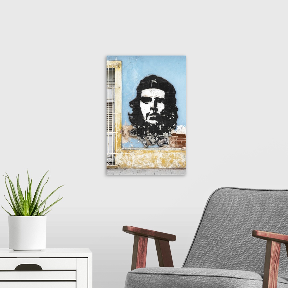 A modern room featuring Photograph of a Cuban facade with Che Guevara graffiti on the side of a light blue building, Hava...