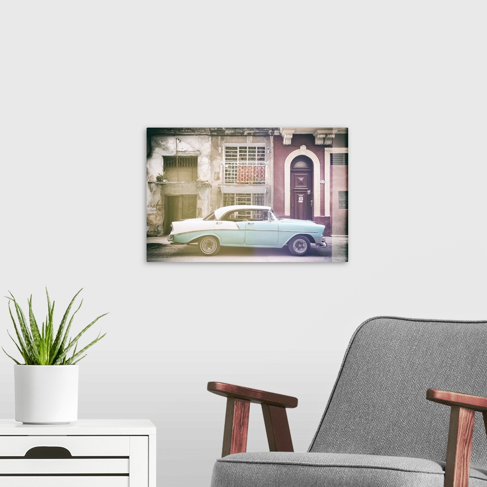 A modern room featuring Faded photograph of a turquoise and white vintage card parked on the side of a street in Havana w...