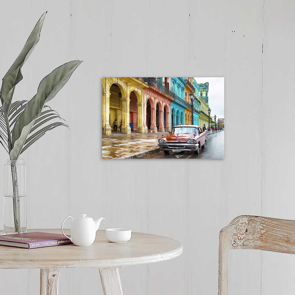 A farmhouse room featuring Photograph of a red vintage car parked outside of a colorful building facade in Havana, Cuba.