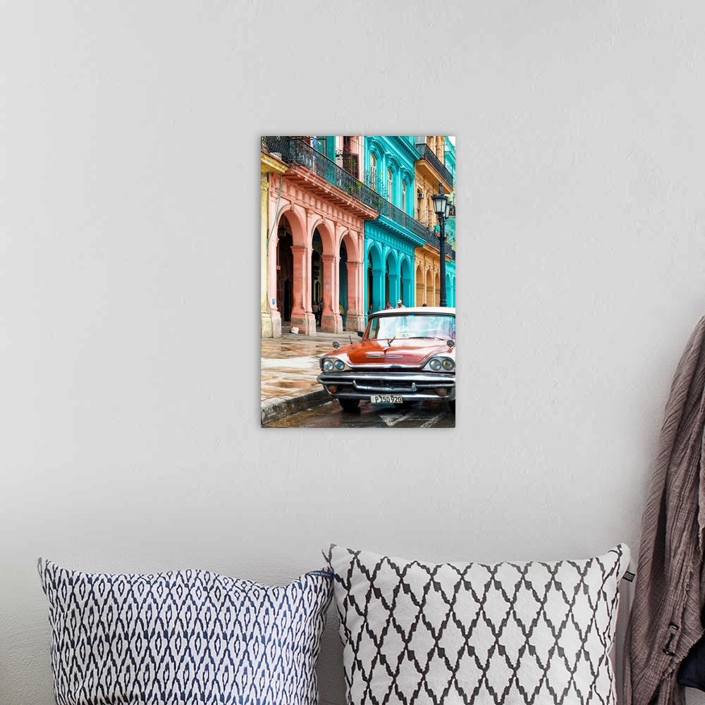 A bohemian room featuring Photograph of a red taxi parked on the wet streets of Havana with a colorful facade to the left.