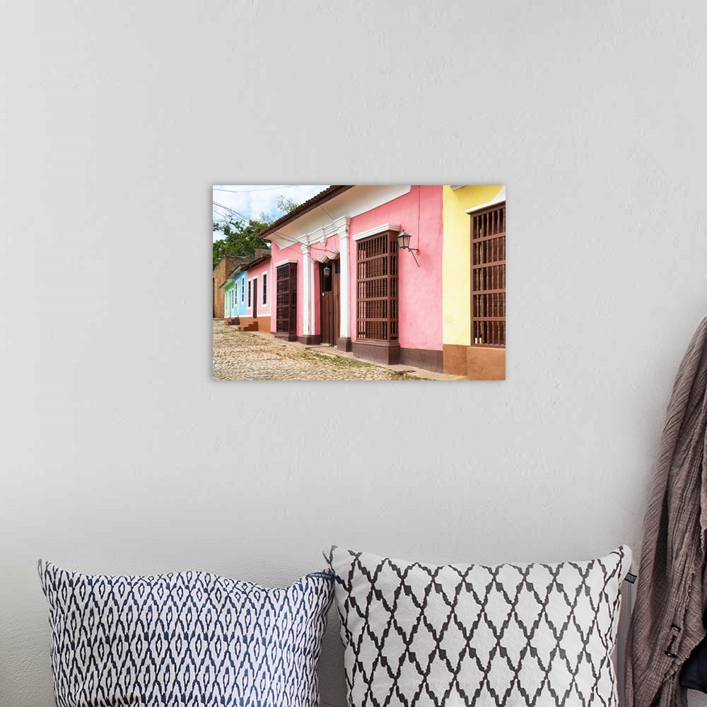 A bohemian room featuring Photograph of colorful facades lining a Trinidad streetscape.