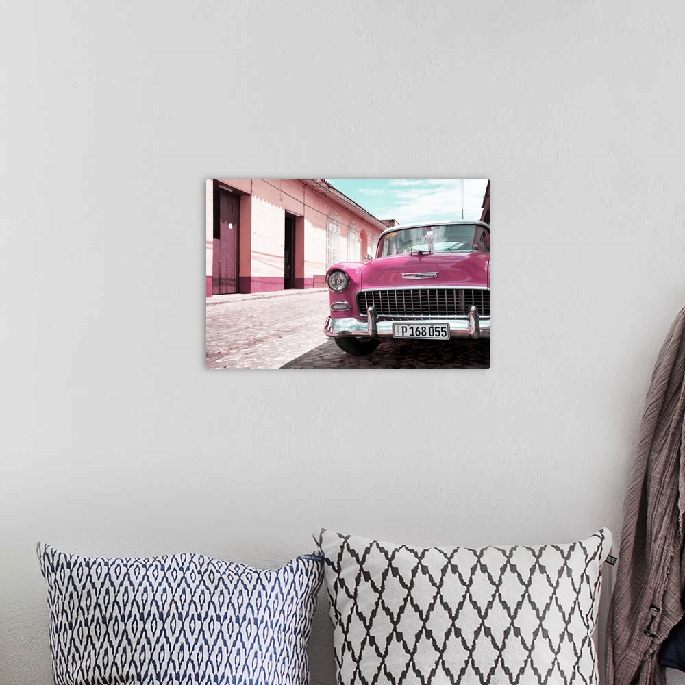 A bohemian room featuring Photograph of the front of a pink vintage Chevy parked on the side of a road.