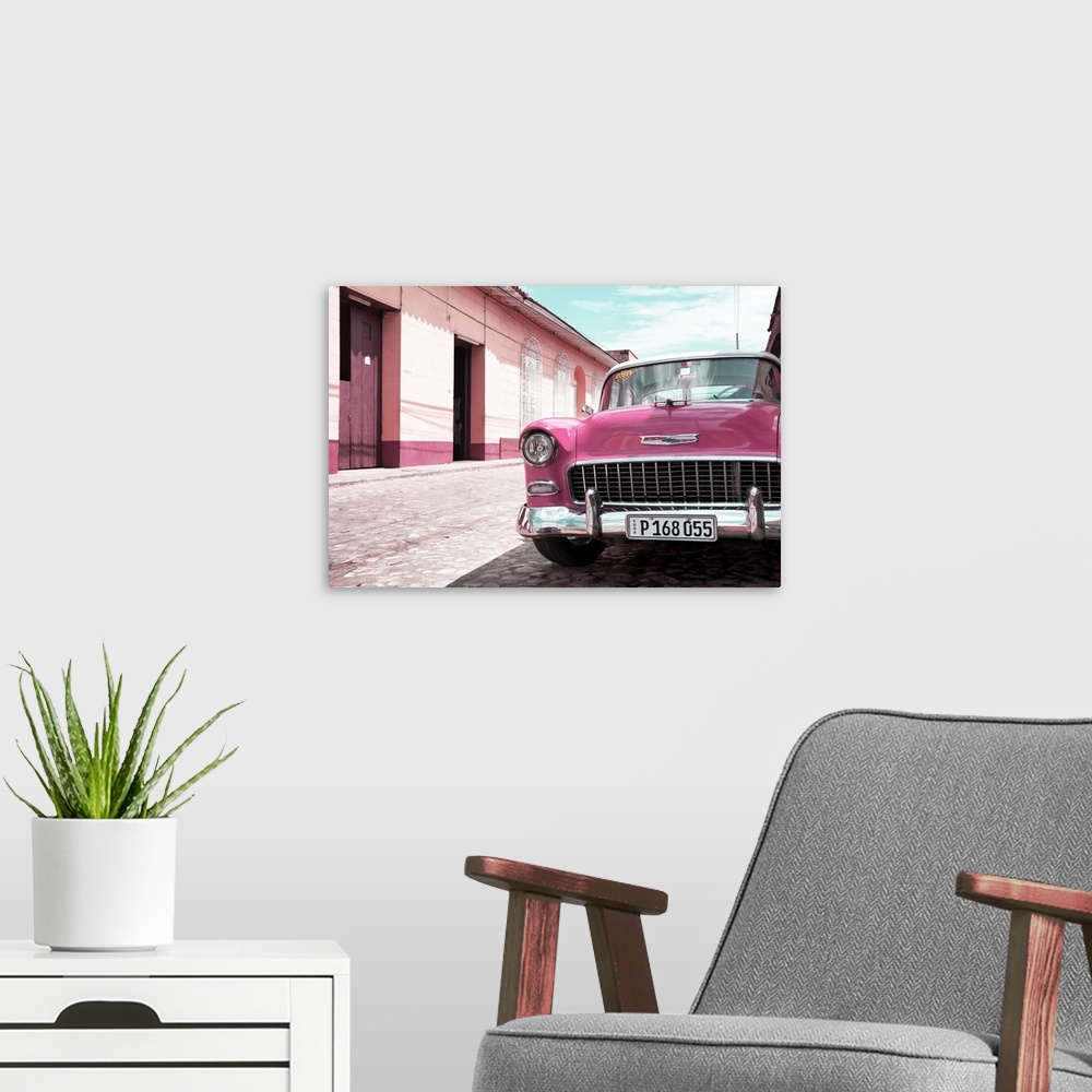 A modern room featuring Photograph of the front of a pink vintage Chevy parked on the side of a road.