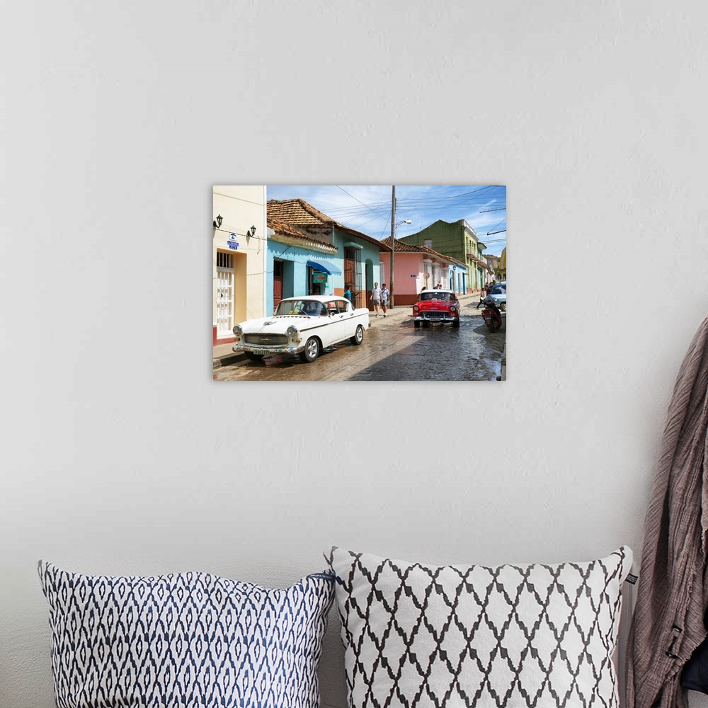 A bohemian room featuring Photograph of a busy Cuban street scene with vintage cars.