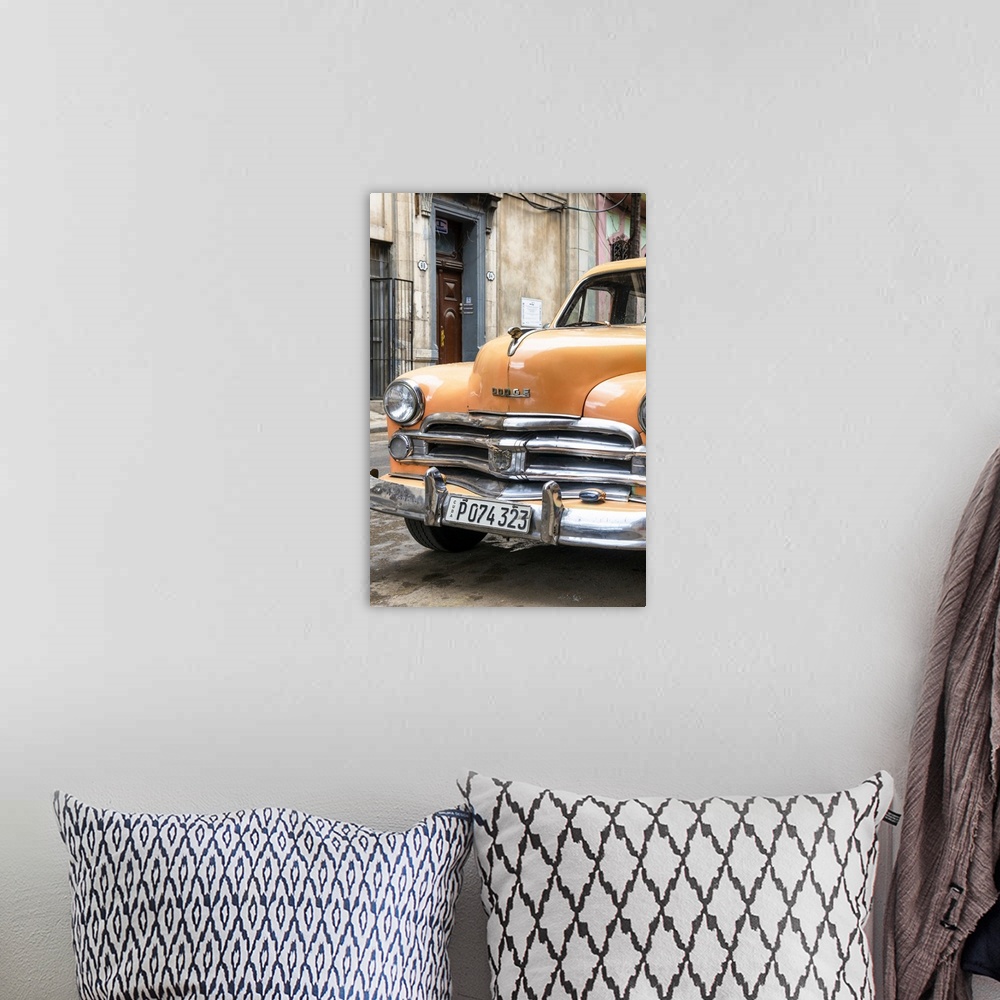 A bohemian room featuring Photograph of the front of an orange vintage Dodge car parked in downtown Havana.