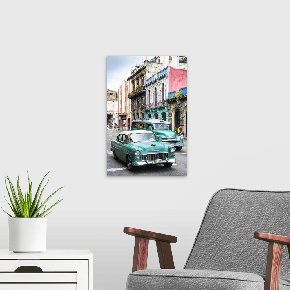 A modern room featuring Photograph of two green vintage Chevrolets in a Havana street scene.