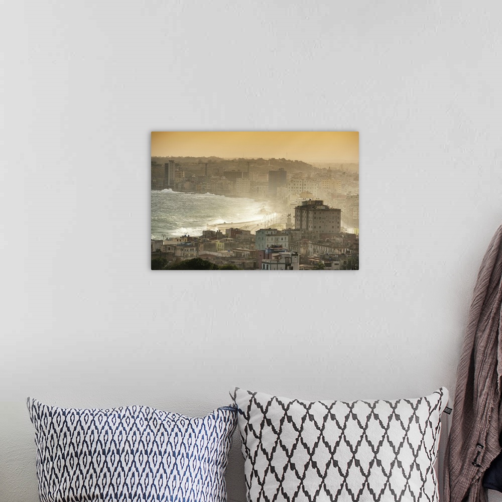 A bohemian room featuring Aerial photograph of the ocean meeting the city of Havana at sunrise.