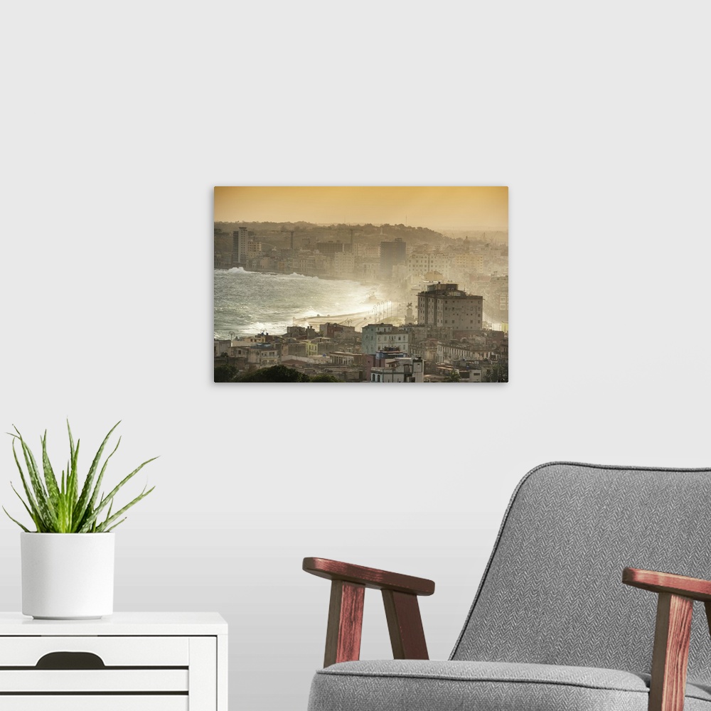 A modern room featuring Aerial photograph of the ocean meeting the city of Havana at sunrise.