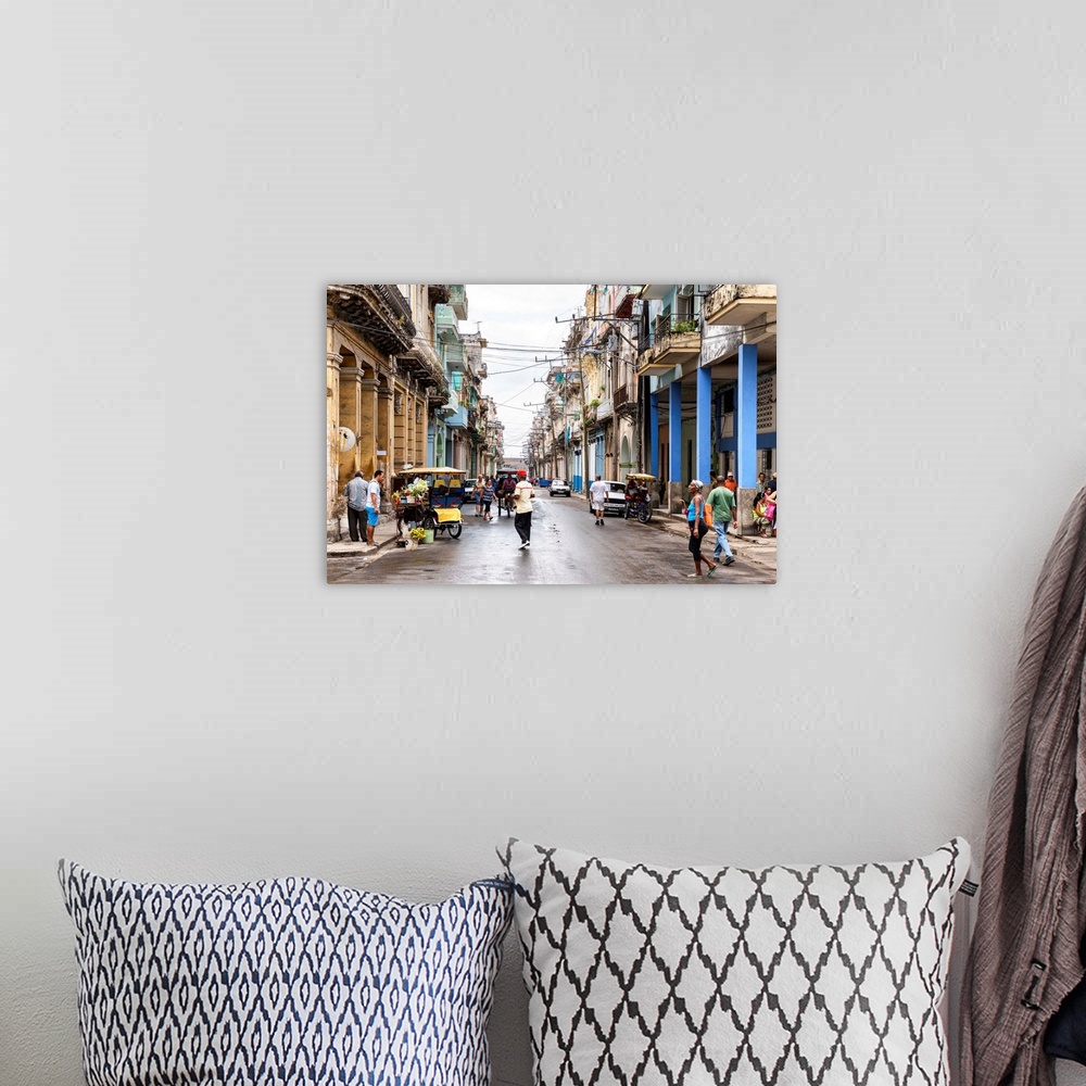 A bohemian room featuring Photograph of a busy street scene in Havana, Cuba.