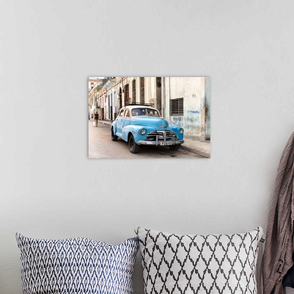 A bohemian room featuring Photograph of a blue vintage Chevrolet parked in the streets of Havana.