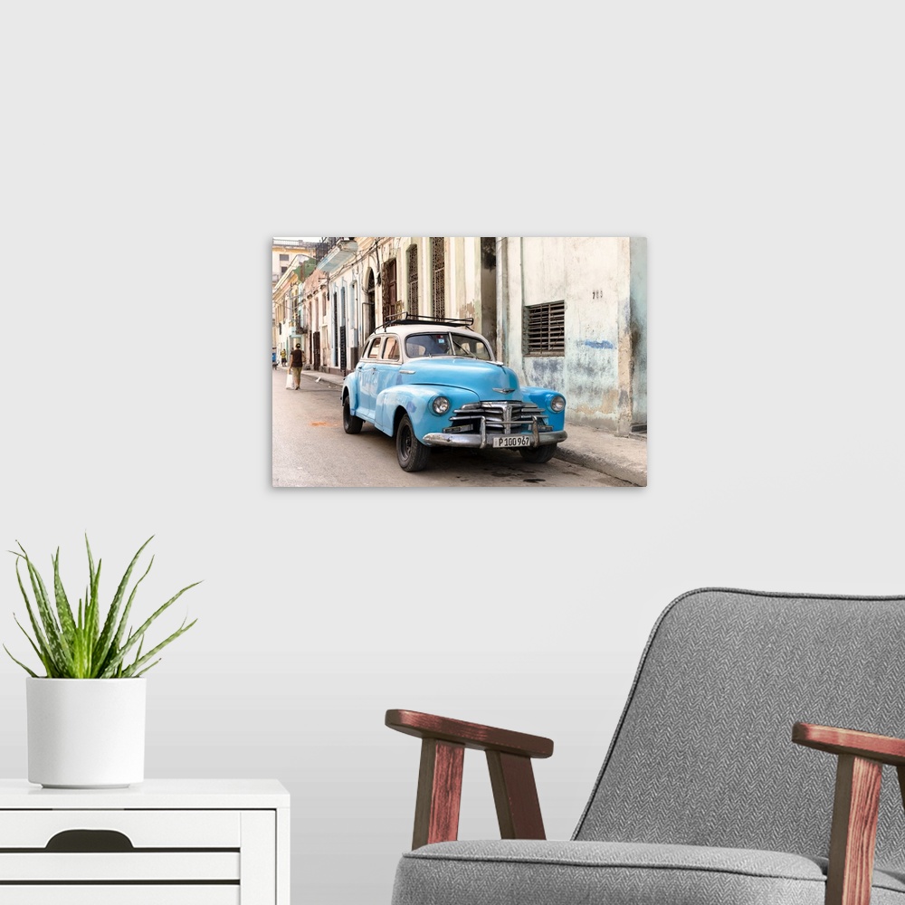 A modern room featuring Photograph of a blue vintage Chevrolet parked in the streets of Havana.