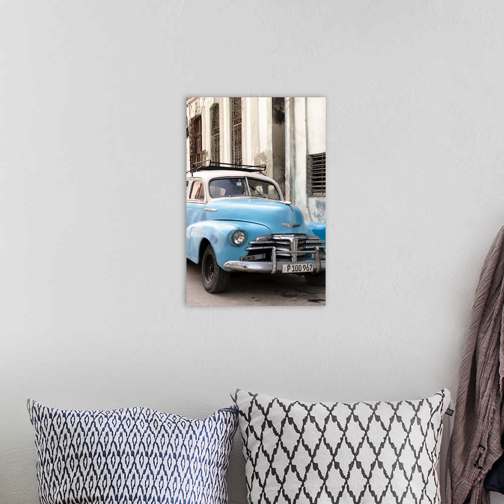 A bohemian room featuring Photograph of a blue vintage Chevrolet parked outside in the streets of Havana.