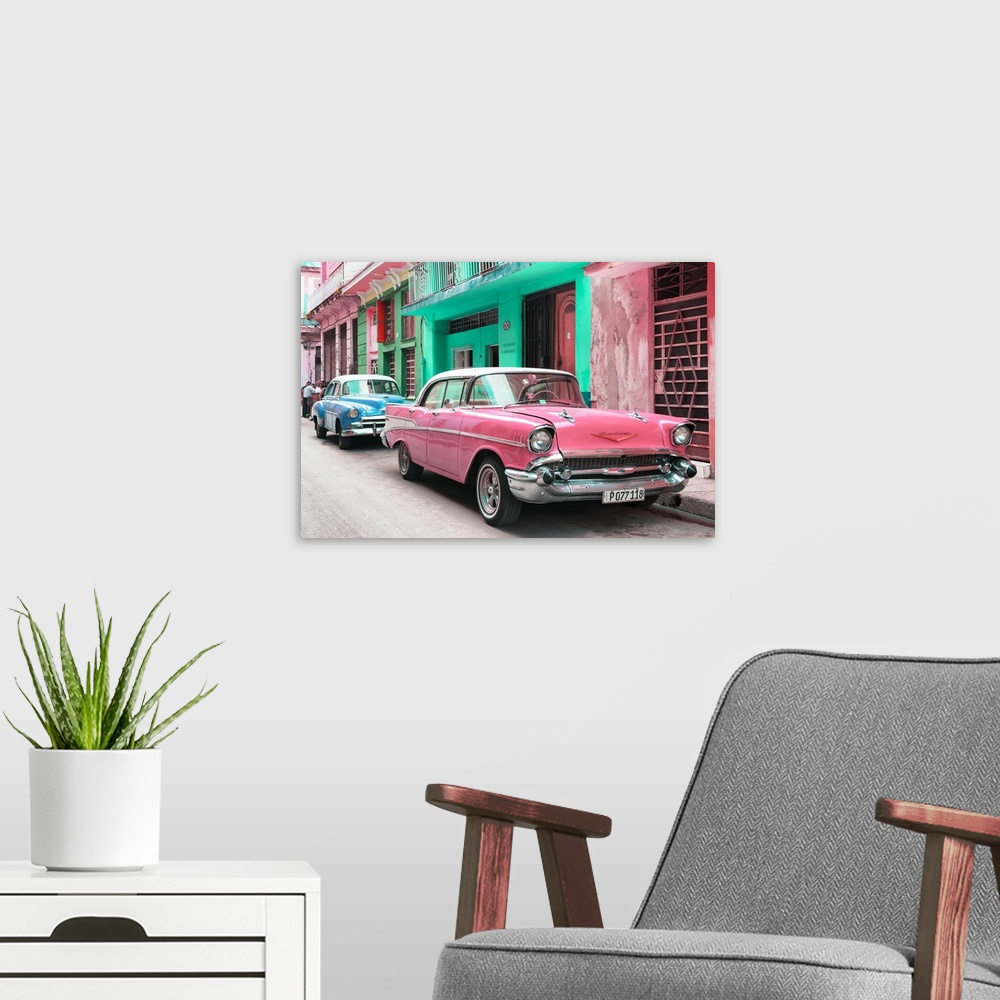 A modern room featuring Photograph of a pink Chevrolet parked outside of brightly colored Cuban facades.