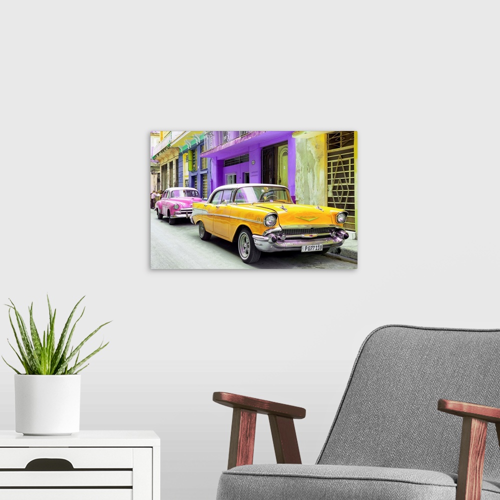 A modern room featuring Photograph of a yellow Chevrolet parked outside of brightly colored Cuban facades.