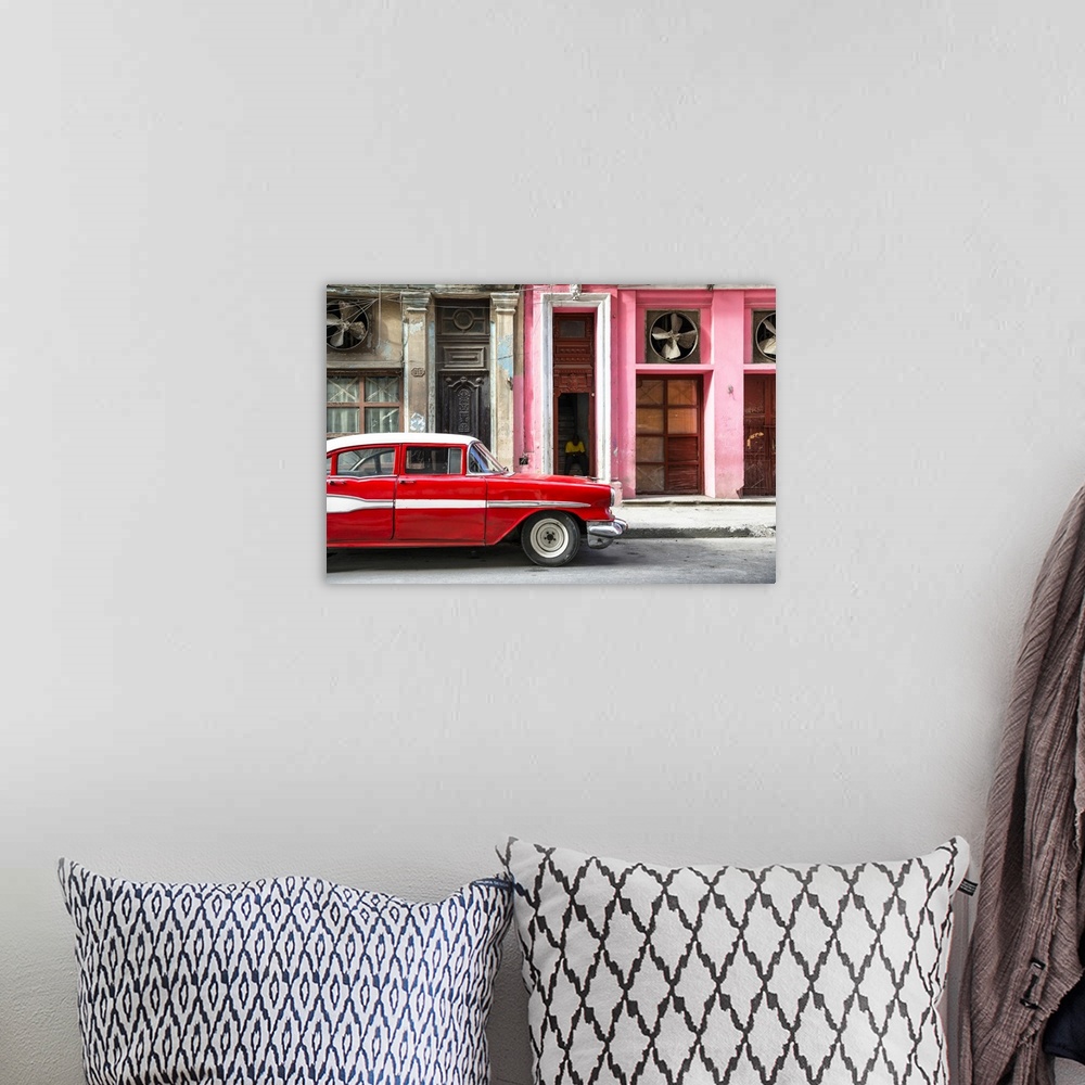 A bohemian room featuring Photograph of a classic old red car in front of a pink facade in Havana, Cuba.